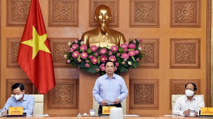 Le Premier ministre Pham Minh Chinh lors d'une rencontre avec des hommes d’affaires vietnamiens. Photo : VOV.