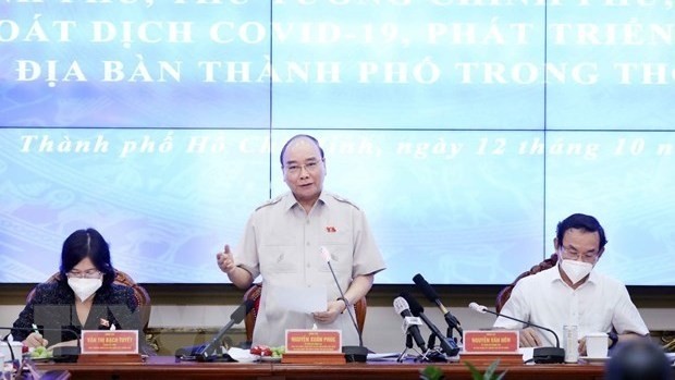 Le Président Nguyên Xuân Phuc à la séance de suivi de la délégation des députés de Hô Chi Minh-Ville. Photo : VNA.