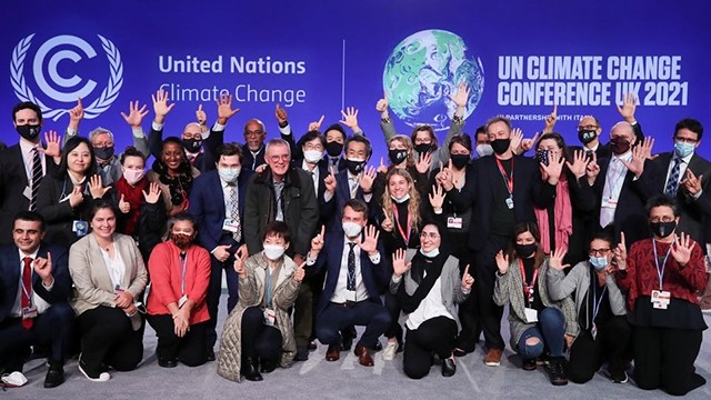 Photo de famille de délégués dès la fin de la Conférence COP26. Photo : Reuters.