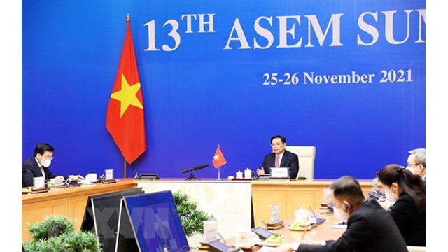 Le Premier ministre Pham Minh Chinh prend la parole lors du 13e Sommet de l'ASEM. Photo : VNA.