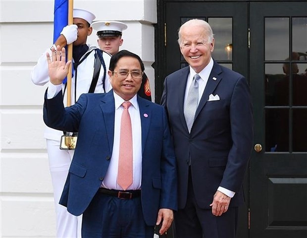 Le Premier ministre vietnamien Pham Minh Chinh (à gauche) et le président Joe Biden. Photo : VNA