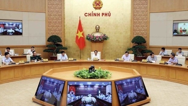Le Vice-Premier ministre Lê Van Thành s'exprime lors de la réunion le 14 juin, à Hanoï. Photo : VNA.
