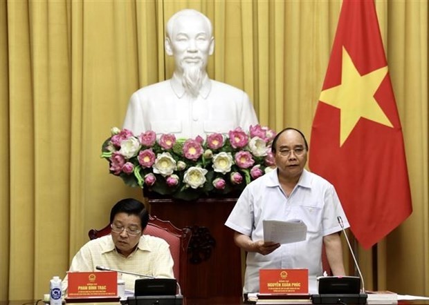 Le Président du vietnam, Nguyên Xuân Phuc (debout), lors de la réunion à Hanoi, le 21 juillet. Photo : VNA.